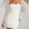 Vestito corto con corsetto decorato a maniche lunghe Milan in avorio Vestito corto con corsetto decorato a maniche lunghe Milan in avorio