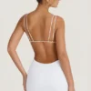 Vestito corto con cut-out e schiena scoperta Eartha in bianco Vestito corto con cut-out e schiena scoperta Eartha in bianco
