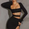 Vestito corto con maniche lunghe e cut-out Enya in nero Vestito corto con maniche lunghe e cut-out Enya in nero