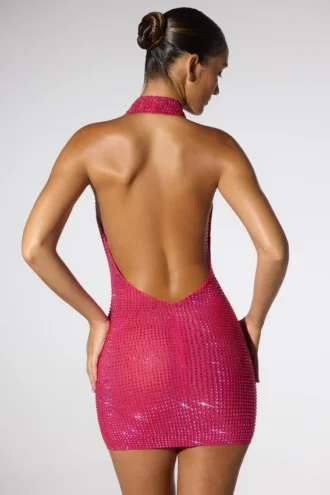 Vestito corto con scollo a cappuccio estremo e lacci al collo Raquel in rosa shocking
