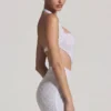 Vestito corto con scollo all’americana e cut-out decorato Lucia in bianco Vestito corto con scollo all’americana e cut-out decorato Lucia in bianco
