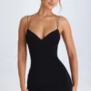 Vestito corto con scollo all’americana e dettagli con cinturini Tesni in nero Vestito corto con scollo all’americana e dettagli con cinturini Tesni in nero