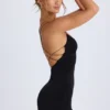 Vestito corto con scollo all’americana e dettagli con cinturini Tesni in nero Vestito corto con scollo all’americana e dettagli con cinturini Tesni in nero