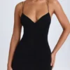 Vestito corto con scollo all’americana e dettagli con cinturini Tesni in nero Vestito corto con scollo all’americana e dettagli con cinturini Tesni in nero