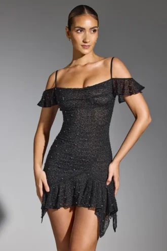 Vestito corto con spalle scoperte e decorazioni Beaufort in nero Vestito corto con spalle scoperte e decorazioni Beaufort in nero
