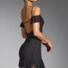 Vestito corto con spalle scoperte e decorazioni Beaufort in nero Vestito corto con spalle scoperte e decorazioni Beaufort in nero