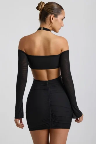 Vestito corto con spalline scese e ruches Kemina in nero Vestito corto con spalline scese e ruches Kemina in nero
