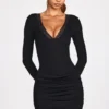 Vestito corto drappeggiato a maniche lunghe in modal a coste Elona, nero Vestito corto drappeggiato a maniche lunghe in modal a coste Elona, nero