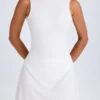 Vestito corto drappeggiato con schiena scoperta Shirin in bianco