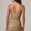 Vestito corto Neréa con decorazioni e ruches in oro Vestito corto Neréa con decorazioni e ruches in oro