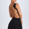 Vestito corto nero con scollo a V e cut-out Kalista Vestito corto nero con scollo a V e cut-out Kalista