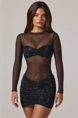 Vestito corto Noel trasparente con decorazioni, collo alto e maniche lunghe in nero