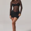 Vestito corto Noel trasparente con decorazioni, collo alto e maniche lunghe in nero Vestito corto Noel trasparente con decorazioni, collo alto e maniche lunghe in nero