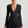 Vestito corto plissettato a maniche lunghe Fiorella in nero Vestito corto plissettato a maniche lunghe Fiorella in nero