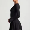 Vestito corto plissettato a maniche lunghe Fiorella in nero Vestito corto plissettato a maniche lunghe Fiorella in nero