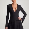 Vestito corto plissettato a maniche lunghe Fiorella in nero Vestito corto plissettato a maniche lunghe Fiorella in nero