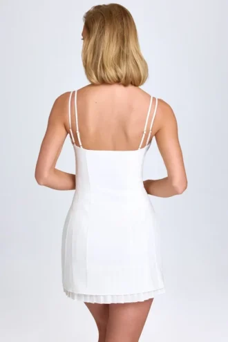 Vestito corto plissettato con fiocco Bronwyn in bianco