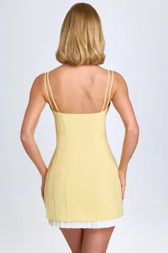 Vestito corto plissettato con fiocco Bronwyn in giallo pastello