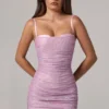 Vestito corto rosa con ruches e cut-out decorato Neréa Vestito corto rosa con ruches e cut-out decorato Neréa