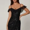 Vestito corto svasato con allacciatura decorata Jacira in nero Vestito corto svasato con allacciatura decorata Jacira in nero