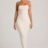 Vestito lungo a fascia con collo a cappuccio e decorazioni Palermo in bianco Vestito lungo a fascia con collo a cappuccio e decorazioni Palermo in bianco