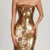 Vestito lungo a fascia Nottola con decorazioni 3D in oro Vestito lungo a fascia Nottola con decorazioni 3D in oro