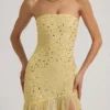 Vestito lungo asimmetrico semi-trasparente con decorazioni Kerra in giallo Vestito lungo asimmetrico semi-trasparente con decorazioni Kerra in giallo
