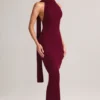 Vestito lungo con scollo all’americana e dettagli a sciarpa in maglia a coste Dree, color vino Vestito lungo con scollo all’americana e dettagli a sciarpa in maglia a coste Dree, color vino