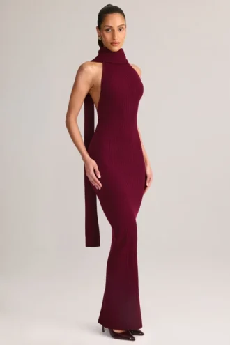 Vestito lungo con scollo all’americana e dettagli a sciarpa in maglia a coste Dree, color vino Vestito lungo con scollo all’americana e dettagli a sciarpa in maglia a coste Dree, color vino