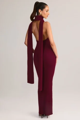 Vestito lungo con scollo all’americana e dettagli a sciarpa in maglia a coste Dree, color vino Vestito lungo con scollo all’americana e dettagli a sciarpa in maglia a coste Dree, color vino