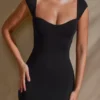 Vestito Meli con scollo a cuore e maniche ad aletta in nero Vestito Meli con scollo a cuore e maniche ad aletta in nero