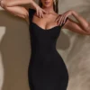 Vestito Meli con scollo a cuore e maniche ad aletta in nero Vestito Meli con scollo a cuore e maniche ad aletta in nero