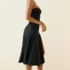 Vestito midi a trapezio senza spalline in jersey slinky Joely, colore nero Vestito midi a trapezio senza spalline in jersey slinky Joely, colore nero