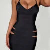 Vestito midi aderente con scollo all’americana e cut-out Nika in nero Vestito midi aderente con scollo all’americana e cut-out Nika in nero