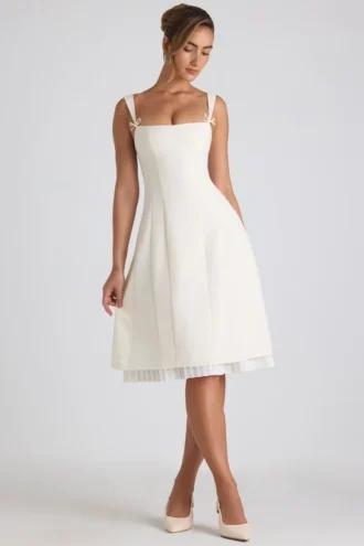 Vestito midi svasato plissettato con fiocco Isadora in avorio