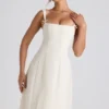 Vestito midi svasato plissettato con fiocco Isadora in avorio Vestito midi svasato plissettato con fiocco Isadora in avorio