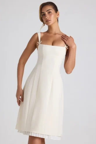 Vestito midi svasato plissettato con fiocco Isadora in avorio