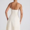 Vestito midi svasato plissettato con fiocco Isadora in avorio Vestito midi svasato plissettato con fiocco Isadora in avorio