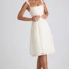 Vestito midi svasato plissettato con fiocco Isadora in avorio Vestito midi svasato plissettato con fiocco Isadora in avorio