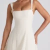Vestito midi svasato plissettato con fiocco Isadora in avorio Vestito midi svasato plissettato con fiocco Isadora in avorio