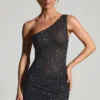 Zahira Vestito corto monospalla con decorazioni in nero Zahira Vestito corto monospalla con decorazioni in nero